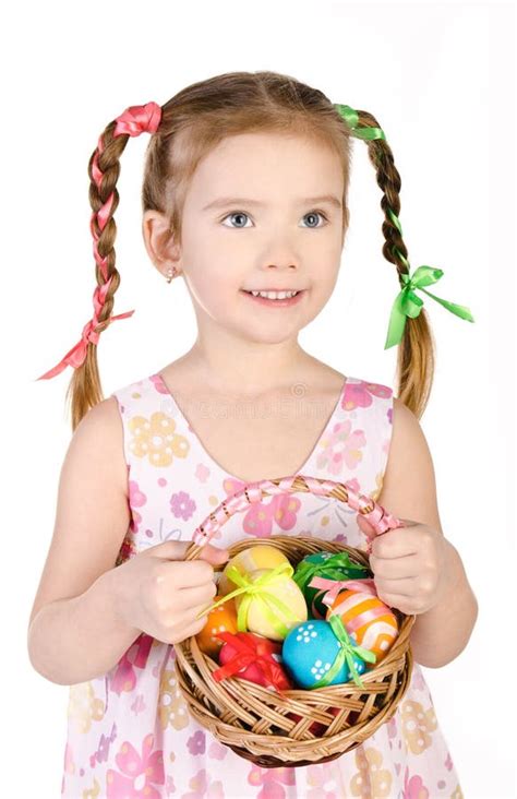 Smiling Little Girl With Basket Full Of Colorful Easter Eggs Iso Stock
