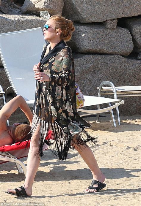 Lindsay Lohan Suffers A Near Wardrobe Malfunction As She Spills Out Of