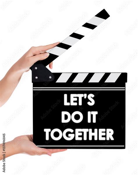 Hands Holding A Clapper Board With Lets Do It Together Text Stock