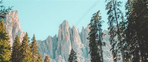 Download Wallpaper 2560x1080 Rocks Mountain Peak Trees Grass Dual