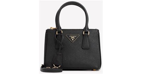 Prada Top Handle Bag In Saffiano Leather In Black Lyst Uk