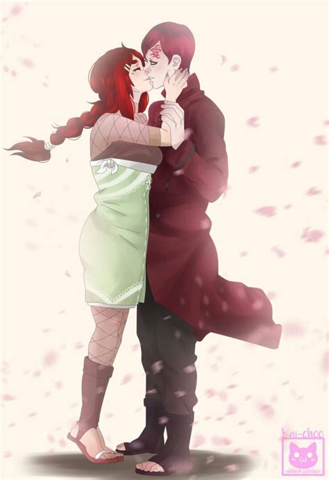 Two People Are Kissing In The Snow With Their Arms Around Each Other