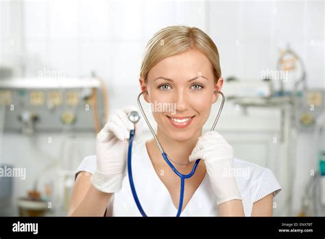 The Kind Doctor Stretches A Stethoscope Forward Against A Hospital