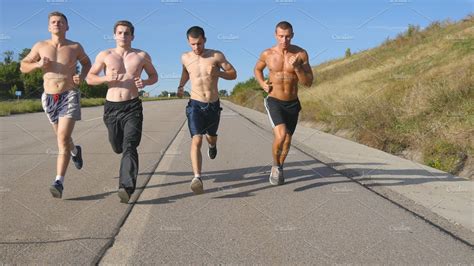 Group Of Runners Men Jogging At Highway Male Sport Athletes Training
