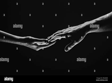 Two Hands Stretch Each Other Black Background Couple In Love Holding Hads Close Up Helping