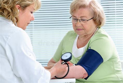 Checking Blood Pressure Stock Photo Image Of Patient 26256954