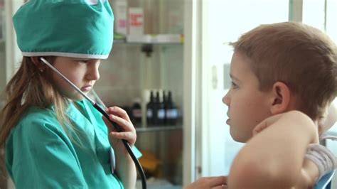 Boy And Girl Playing Doctor And Patient Stock Footage Videohive