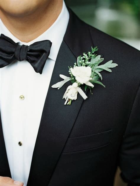 Picture Of Black Tuxedo With A Fresh Greenery Boutonniere