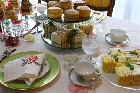 Enhancers for the table should include sliced lemon, sugar cubes, honey, milk, devon or clotted cream, and preserves. Table de France: Afternoon Tea Table Decoration