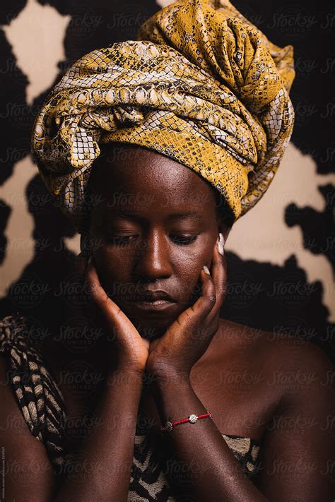 Portrait Of A Beautiful Young Black Woman Looking Down Del Colaborador De Stocksy Michela