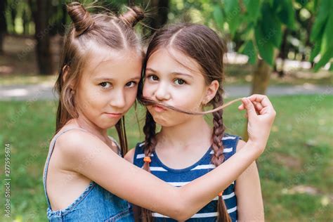 Two Cute Babe Girls Having Fun In Park In Sunny Summer Day Stock Photo Adobe Stock