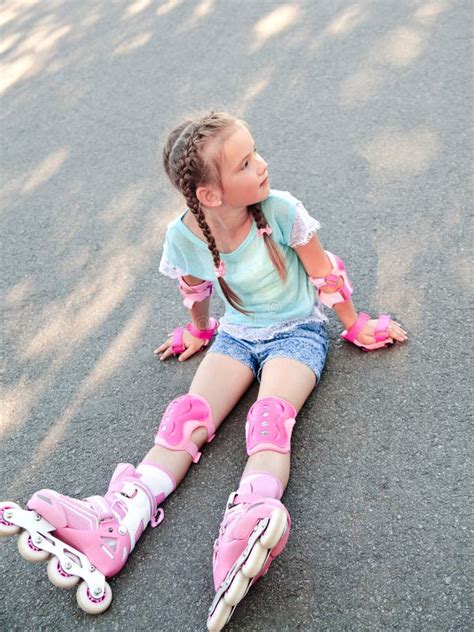 Cute Smiling Little Girl In Pink Roller Skates Stock Photo Image Of