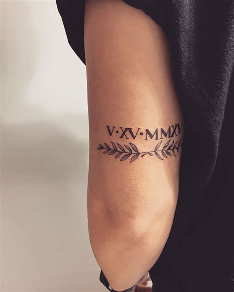 Roman Numerals W Olive Branches Above Elbow Tattoo Roman Numeral
