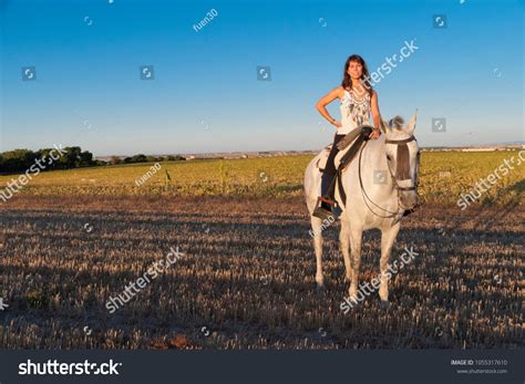 Young Woman Mounting Astride Stock Photo 1055317610 Shutterstock