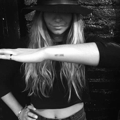 "Hey Jude" tattoo on the wrist.