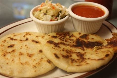 It is made using corn tortilla and filled with a blend of cheese, beans and pork. Pupusas El Salvador curtido y salsa | Yummi Foods ...