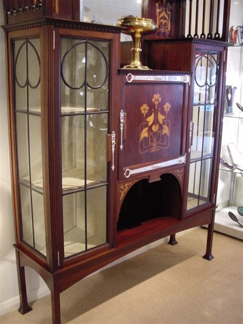 But, by cutting the tiles into a scallop shape, you're giving your kitchen a little bit of uniqueness as opposed to a subway tile. ART NOUVEAU DISPLAY CABINET | The Design Gallery