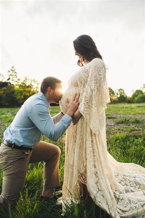 Father Kissing Moms Belly At Maternity Session With Long Lace Dress Mom Belly Maternity