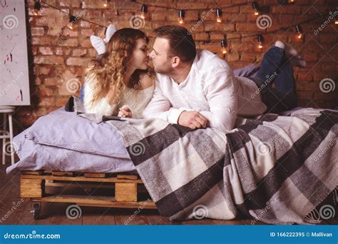 Romantic Couple Kissing In Bed Stock Image Image Of Bedroom