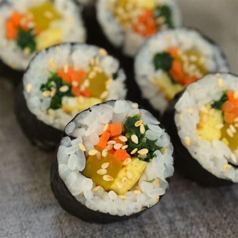 Drizzle 2 tbsp of korean plum extract and a couple pinches salt over freshly cooked rice and toss well. How To Make Gimbap: Korean Seaweed and Rice Rolls | Kitchn