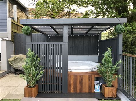 | see more ideas about covered hot tub, outdoor spa and how to assemble a cedar hot tub & chofu wood stove. Modern grey pergola.Lazy spa hot tub, iroko surround | Hot ...