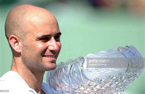 Andre Agassi Of The Usa Holds Aloft The Trophy After Winning The