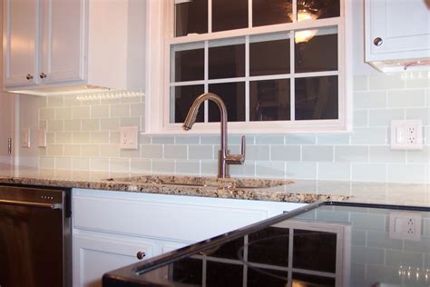 A contemporary kitchen with high end appliances and a beautiful white subway tile backsplash with a light grout. White Glass Subway Tile Kitchen Backsplash - Traditional ...