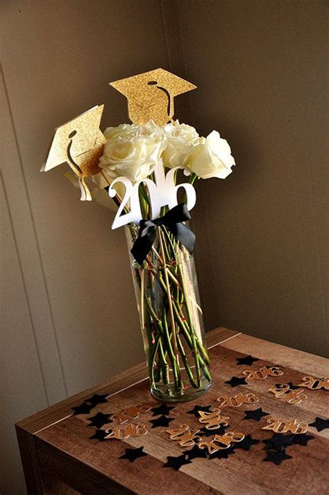 The best way to present graduation flowers as a gift depends on several factors, including the setting, whether you're presenting them in person, and when you're giving the grad their gift. Graduation Centerpiece. (2 Single Graduation Cap Wands & 1 ...
