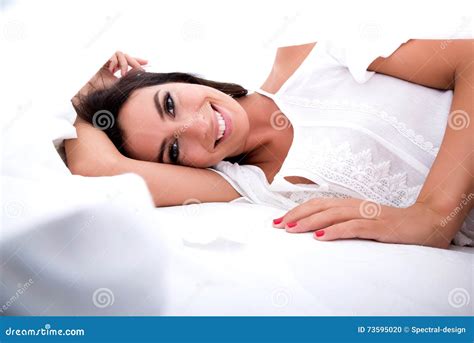 A Beautiful Young Woman Under The Sheets In The Bed Stock Photo Image