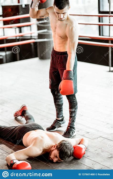 Boxer Winner With Beaten Man On The Boxing Ring Stock Photo Image Of