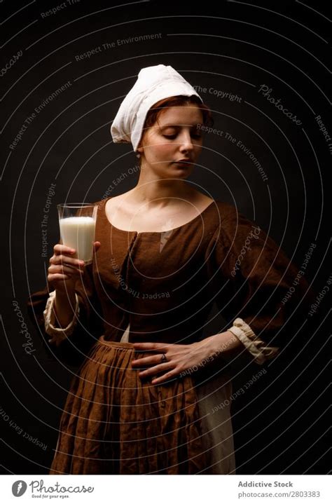 Medieval Maid With Glass Of Milk A Royalty Free Stock Photo From
