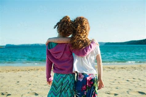 Image Of Two Girls Hugging At The Beach Austockphoto