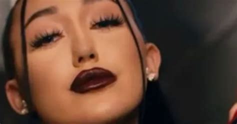 Noah Cyrus Sensually Touches Herself In Black Leather Fishnets For All Three Music Video