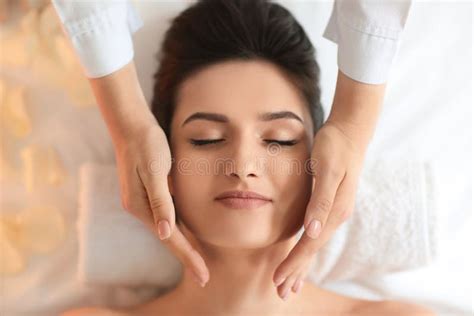 Young Woman Receiving Face Massage In Spa Salon Top View Stock Image Image Of Lifestyle