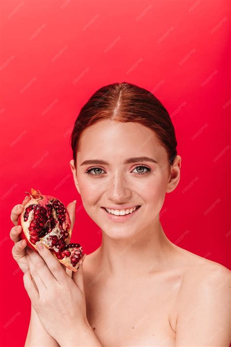 Free Photo Dreamy Ginger Woman Holding Garnet And Laughing Happy