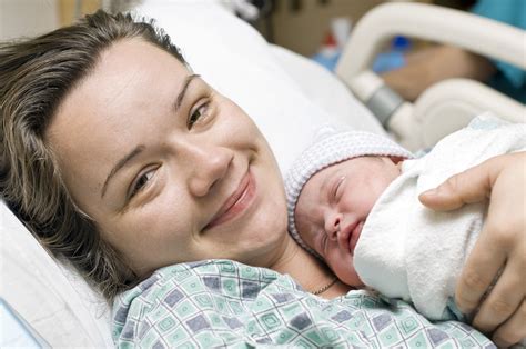 Happy Mother With Newborn Baby Being