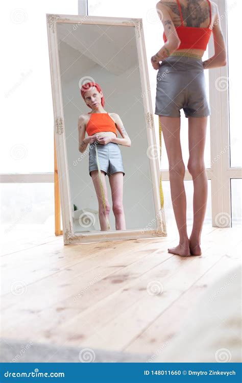 Anorexic Woman Watching Herself In A Mirror Stock Image Cartoondealer Com