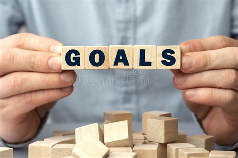 Cropped View Of Man Holding Wooden Blocks With Word Goals Stock Image