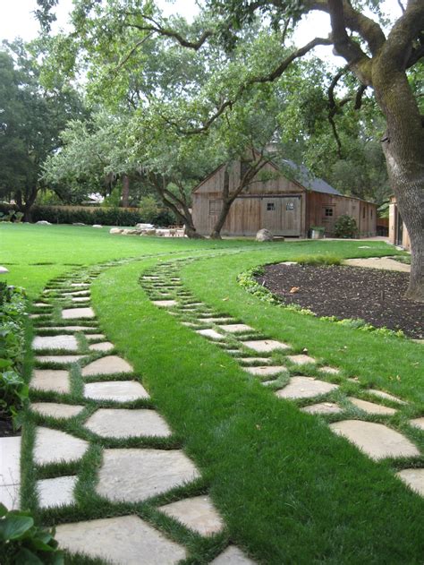 You might not be able to grow grass in a certain area, but you can make up for it with plants or even a patio. Ribbon Driveway | Houzz (With images) | Driveway ...