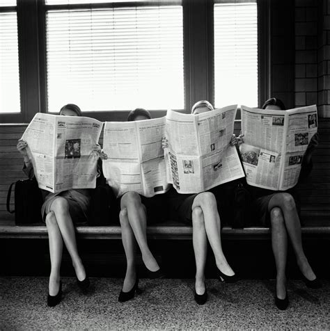 Four Businesswomen Sitting Reading Newspapers Black And White
