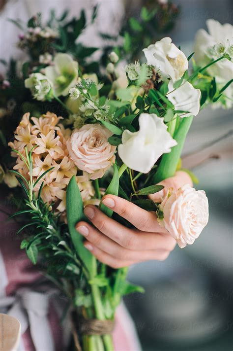 Woman Holding Spring Flowers Bouquet By Stocksy Contributor Adrian