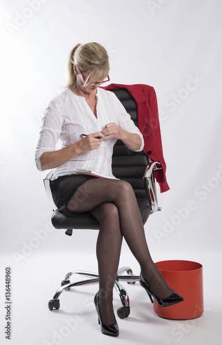 Concept Of Female Office Worker Unfastening Her Shirt In A Office