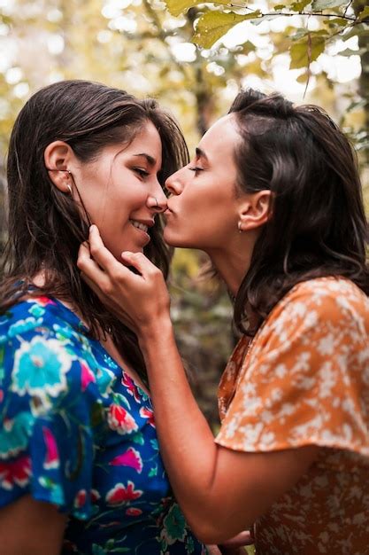 Premium Photo Close Up Of Lesbian Couple Romancing In Forest