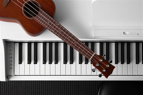 Free Photo | View of piano and guitar in musical instruments store