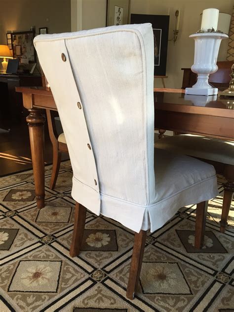 This dining chair with arms has a monogram and a box pleated skirt. Pam Morris Sews: Dropcloth Slipcovers for Leather Parsons ...