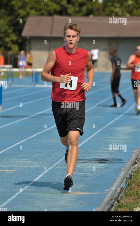 Teenage Boy Runner At The Track And Field Competition During The Stock