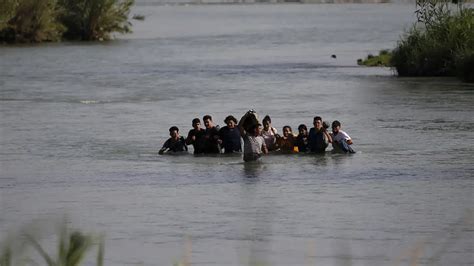 Migrants Cross Rio Grande River Into Us In Texas