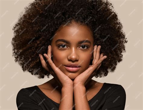 Premium Photo Beautiful African Woman Black T Shirt Portrait Afro Haircut Touching Her Face