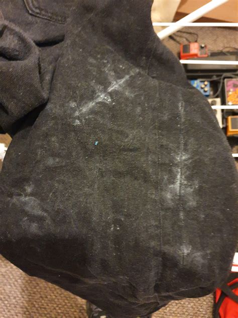 Wit White Marksresidue On Black Jeans After Being Washed Marks Were