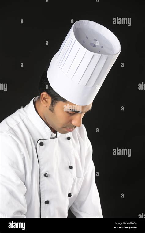 Cooking Profession And People Concept Happy Male Indian Chef In Toque With Ladle Showing